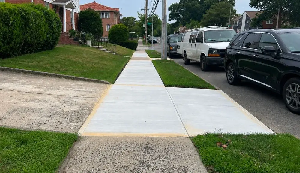 Completed driveway apron and curb cut at 69-03 226th St, Oakland Gardens